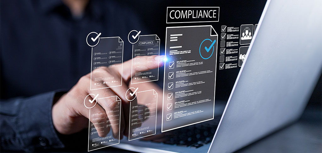 Digital interface showing compliance management on a laptop with checklist documents and regulatory controls